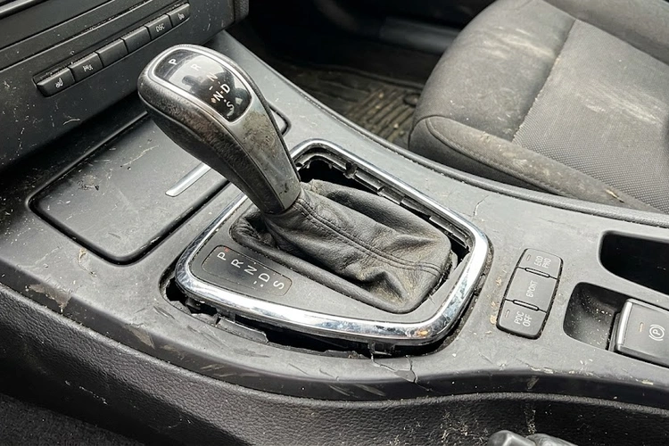 Worn spark plug with carbon fouling and eroded electrode showing classic bad spark plug symptoms