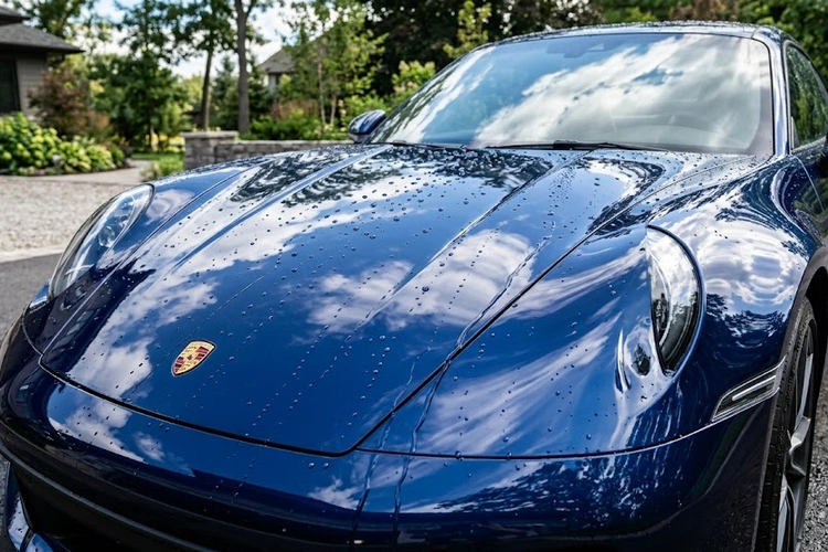 best ceramic coating for cars applied to black vehicle showing hydrophobic water beading effect on paint surface