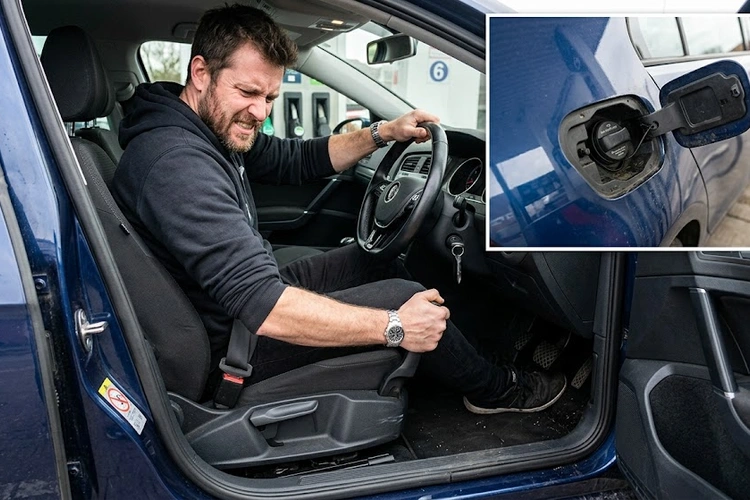 Stuck fuel door that won't open on a passenger vehicle showing the latch and hinge area