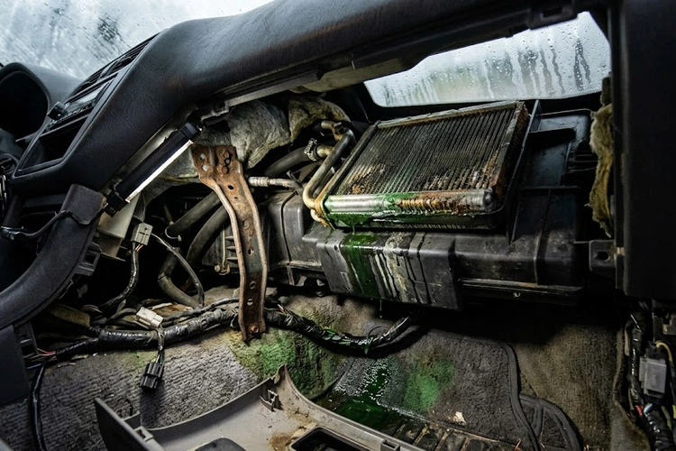 heater core failure symptoms including foggy windshield and damp passenger footwell carpet