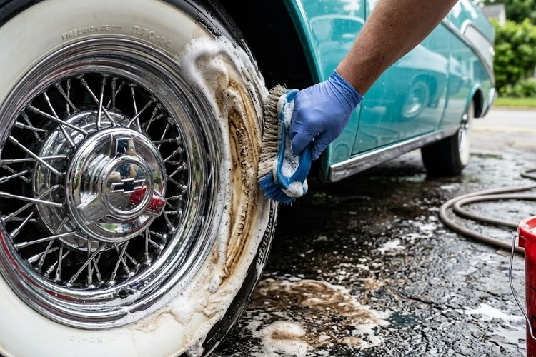 Dedicated brush scrubbing a whitewall tire to remove embedded road grime and brake dust
