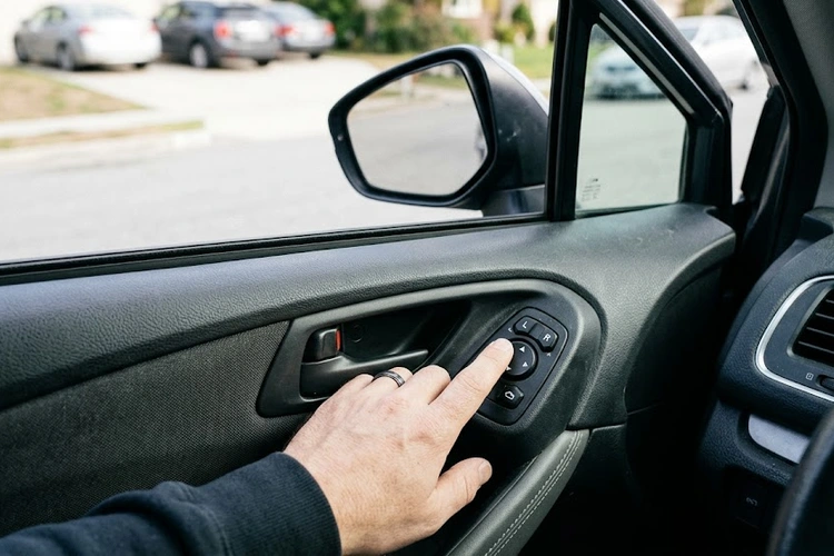 power mirrors not working — driver door panel with mirror control switch and mirror housing