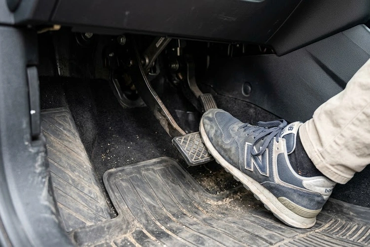 Close-up of brake master cylinder and hydraulic lines illustrating spongy brake pedal root causes