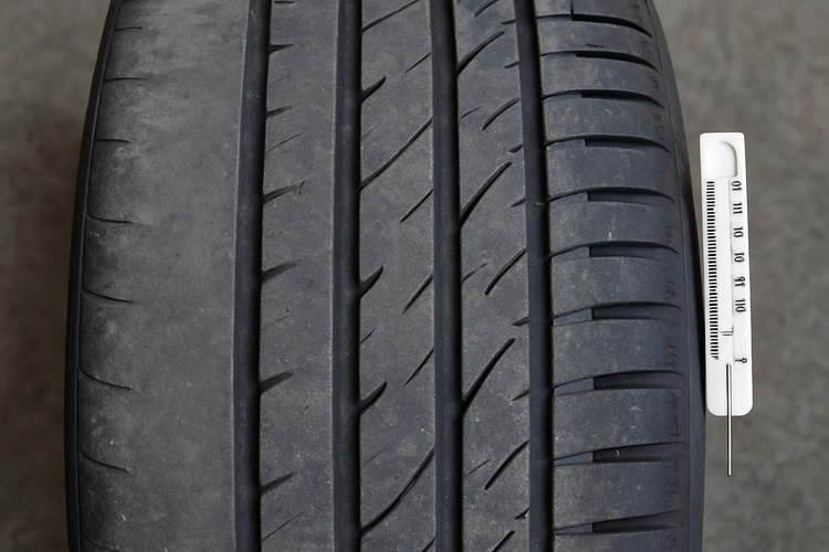 Various tire wear patterns meaning shown on worn tires side by side